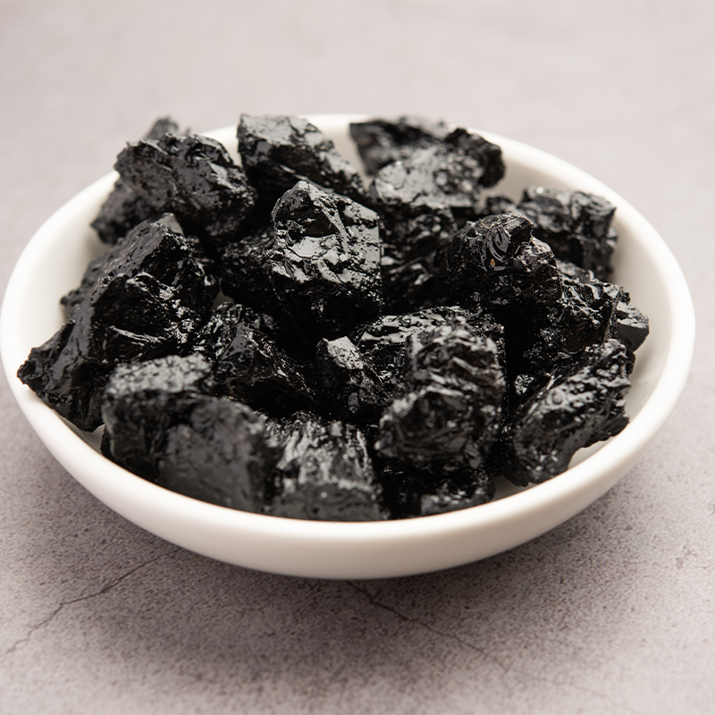 Black Himej The seeds are small, round, and shiny black in color, with a smooth texture. They are arranged in a neat pattern, showcasing their uniform size and shape. The image captures the distinct appearance of black Himej seeds, which are commonly used in traditional Indian Ayurvedic medicine for their potential health benefits. The alt text conveys the small size, shiny black color, and smooth texture of black Himej seeds, which are known for their potential digestive and antioxidant properties.