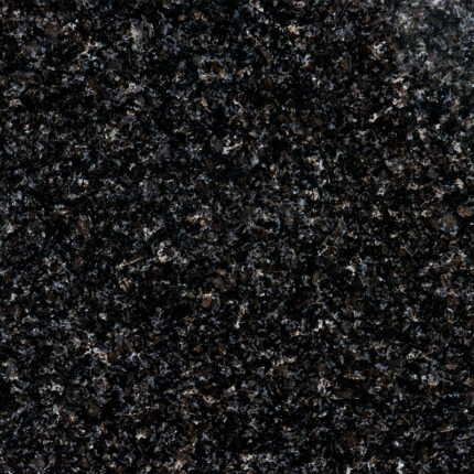 a beautiful natural stone with a black background and iridescent silver and green flecks, adding a touch of shimmer and elegance to any room.