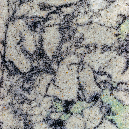 a stunning natural stone with a warm blend of burgundy, gold, and gray tones, featuring intricate patterns and waves, adding depth and texture to any space.
