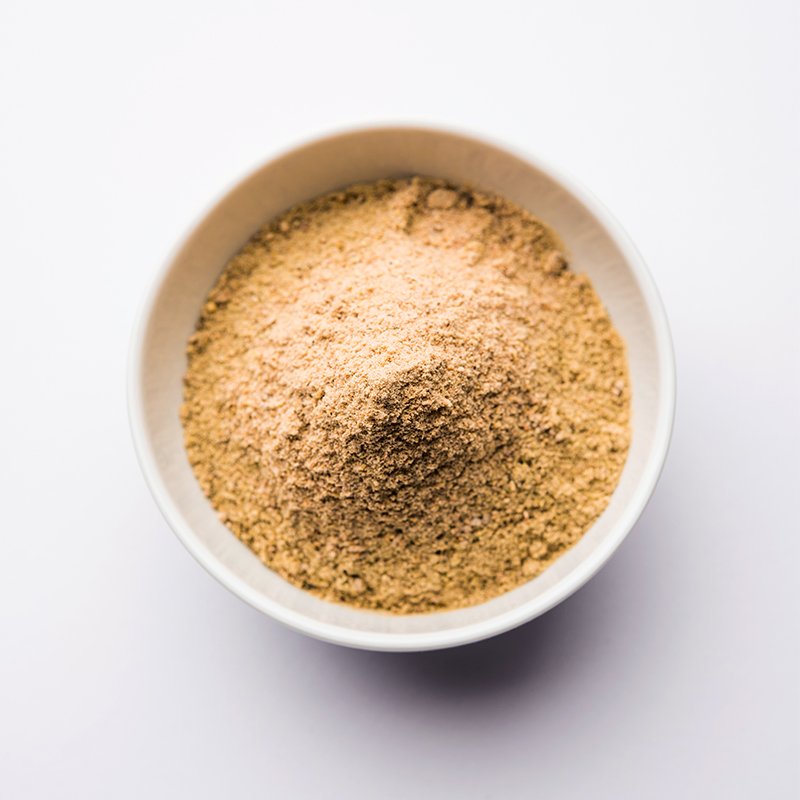 fenugreek is a pile of brownish-yellow, rectangular-shaped fenugreek seeds.