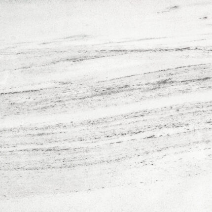 a close-up view of the marble's smooth white surface with delicate, gray veining patterns, resembling the soft rumble of thunder on a cloudy day.