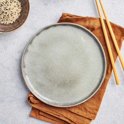 A classic, fine porcelain plate showcasing a delicate and refined design. Known for its high-quality craftsmanship and timeless elegance, this china plate is ideal for formal dining occasions and special events.