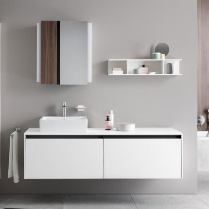 The furniture may include cabinets, shelves, vanities, or towel racks. It is available in various materials such as wood, metal, or plastic, and can be freestanding or attached to the wall.