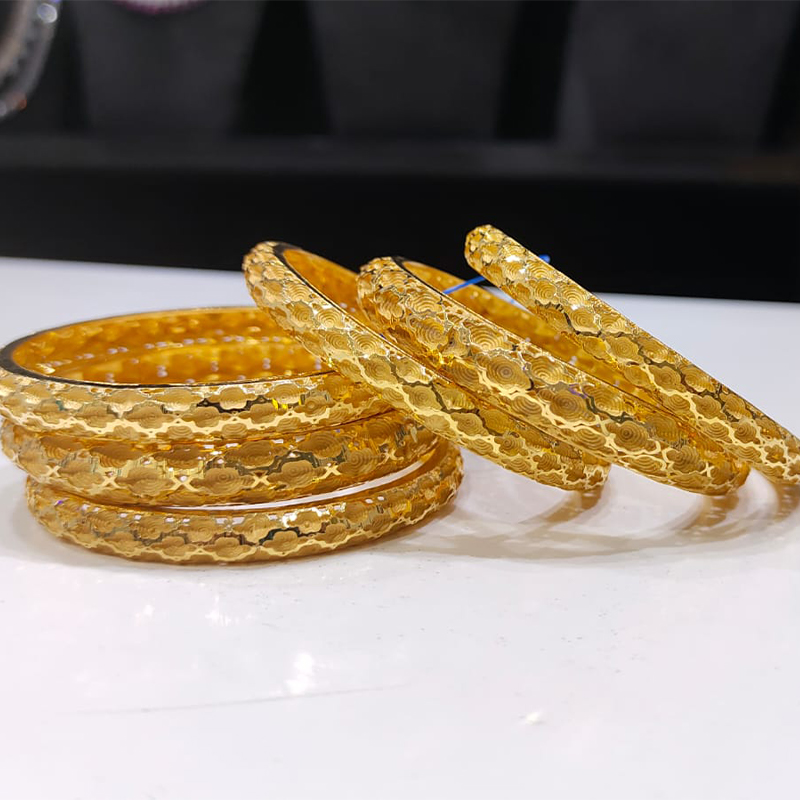 Bangles . They may be plain, engraved, textured, or adorned with gemstones or intricate patterns. Gold bangles are a popular accessory in many cultures and are often worn for special occasions, festivals, or as everyday jewelry.