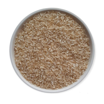 The grains of Mogra rice are slender and long, with a white color. The image may show a bowl of cooked Mogra rice or a pile of uncooked rice grains. Mogra rice is known for its exquisite fragrance, often compared to the aroma of jasmine flowers.