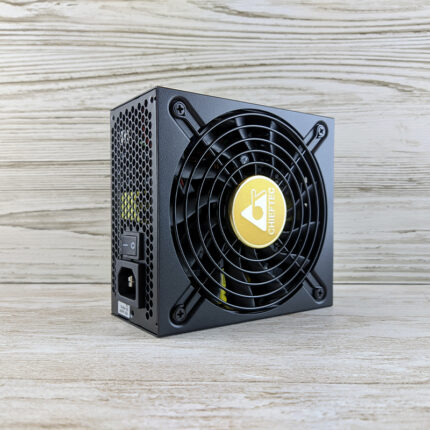The PSU image may show the external casing, which is typically rectangular and made of metal. It may also include branding or labels indicating the manufacturer or power rating.