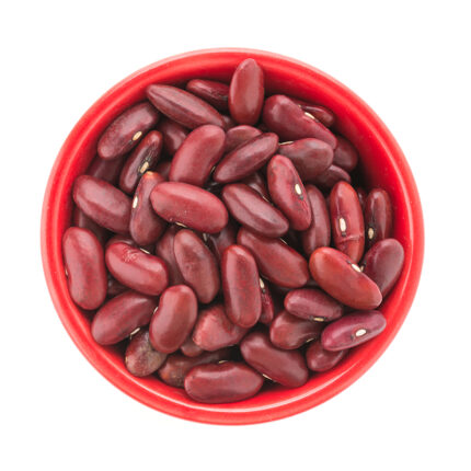 The image captures the appearance of red kidney beans, a popular legume known for their rich, meaty flavor and versatile use in various dishes. The alt text conveys the oval shape, deep red color, and shiny surface of red kidney beans.