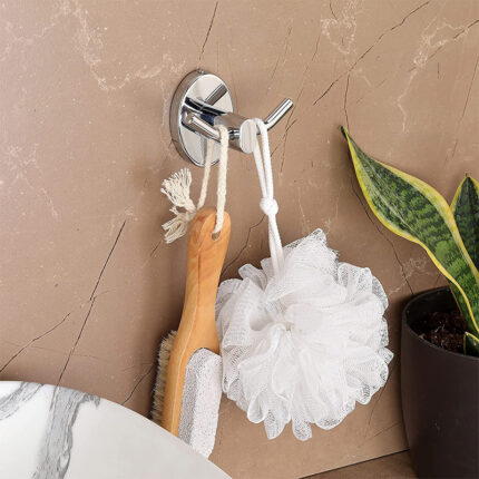The robe hook is typically made of metal, such as chrome or stainless steel, and features a curved or L-shaped design. It is installed on a wall, usually in a bathroom or bedroom, and provides a convenient and accessible spot for hanging garments.