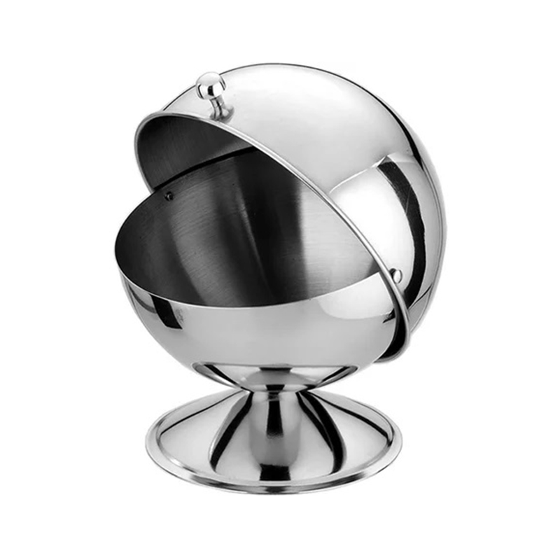 Sugar cube bowl The bowl is made of clear glass and has a cylindrical shape with a flat base and open top. Inside the bowl, there are neatly arranged sugar cubes, typically white or brown in color.