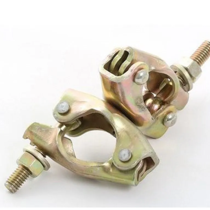 . The coupler has a rectangular shape and is made of pressed steel with a silver or gray finish. It has two sets of jaws, each with teeth that grip onto the tubes, and a bolt that can be tightened to secure them in place. The coupler can swivel in any direction, allowing for a range of configurations and angles when constructing a scaffold.