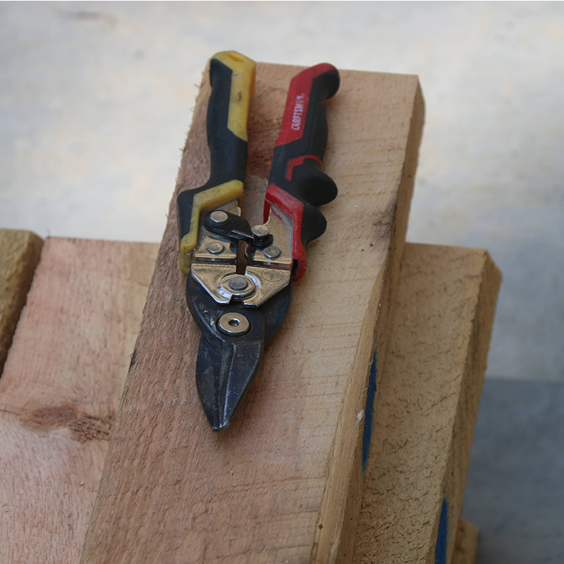 snips a small cutting tool with two sharp blades that are used for cutting thin materials such as paper, fabric, or wire. Snips have a spring mechanism that allows the blades to open and close smoothly and are commonly used in crafting, sewing, and electrical work.