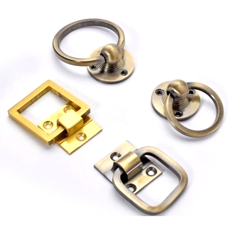 BRASS PULL RINGS Decorative brass rings designed for easy pulling and opening of drawers, cabinets, or doors.