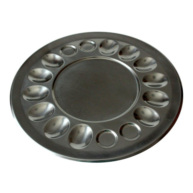 Egg plate A dish specifically designed for serving eggs. An egg plate typically has compartments or wells to hold individual eggs, keeping them separated and preventing them from rolling around.