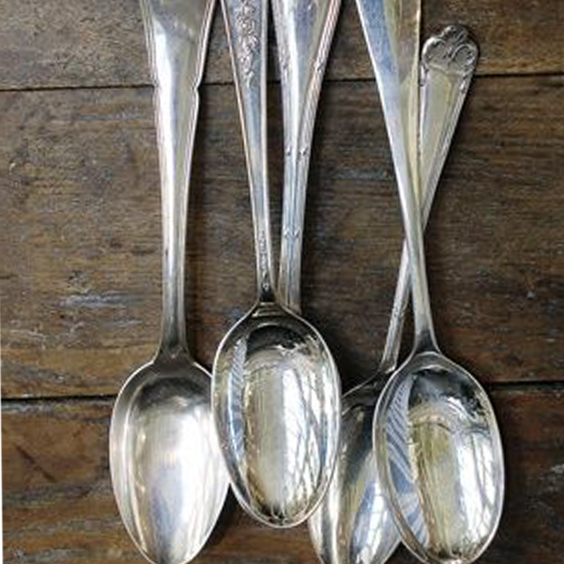 Table spoon A standard table spoon, a common utensil used for measuring and serving food. It has a moderate-sized, oval-shaped bowl at one end and a handle at the other, making it suitable for various dining and cooking purposes.